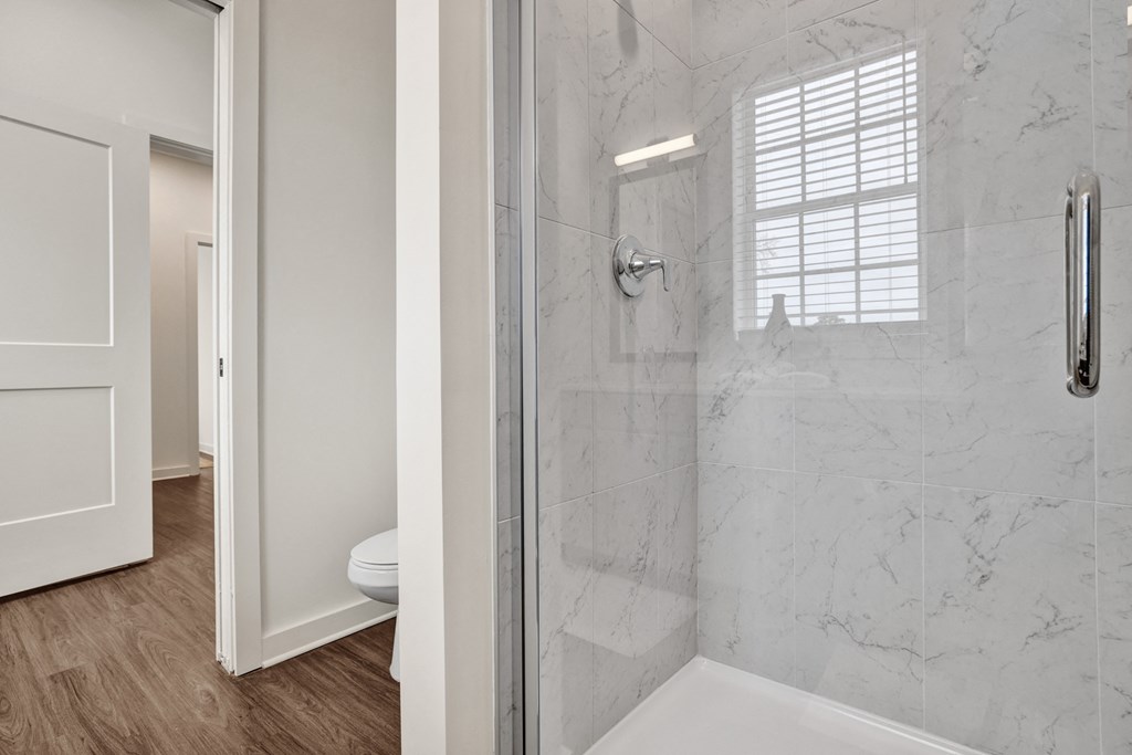En-suite bathroom with stand-alone shower at West Row Townhomes and at West Row Townhomes at West Row Lofts and Townhomes in Birmingham, AL